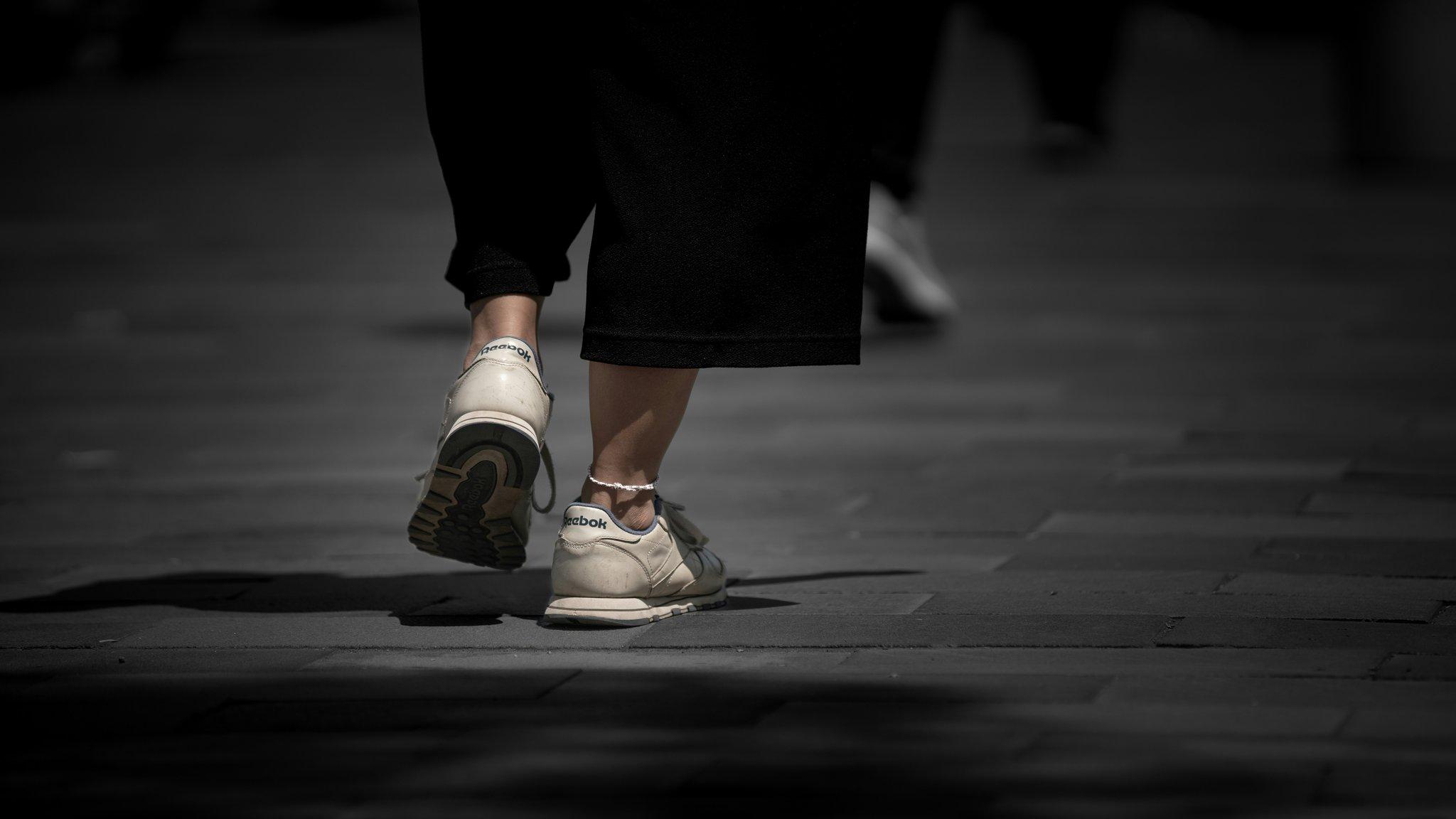 Golden milk latte in a white mug with saffron strands