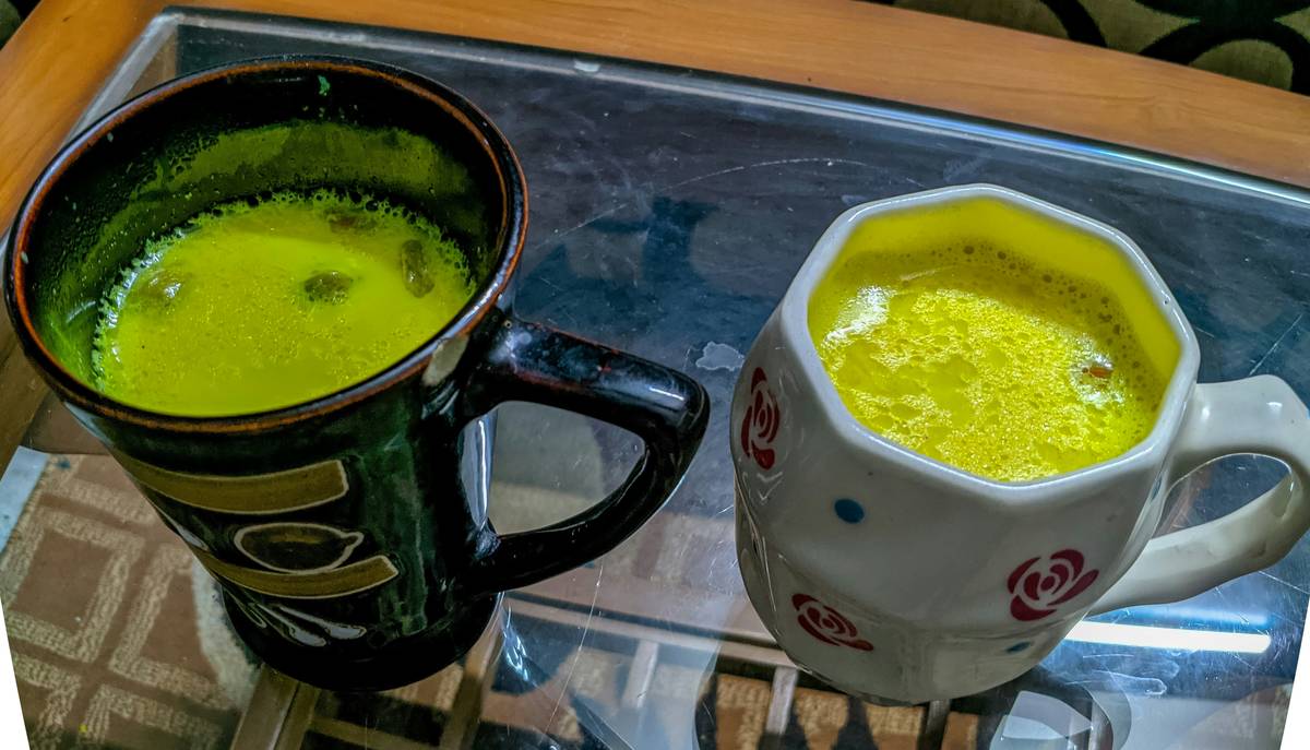 A mug of golden milk made with turmeric and spices