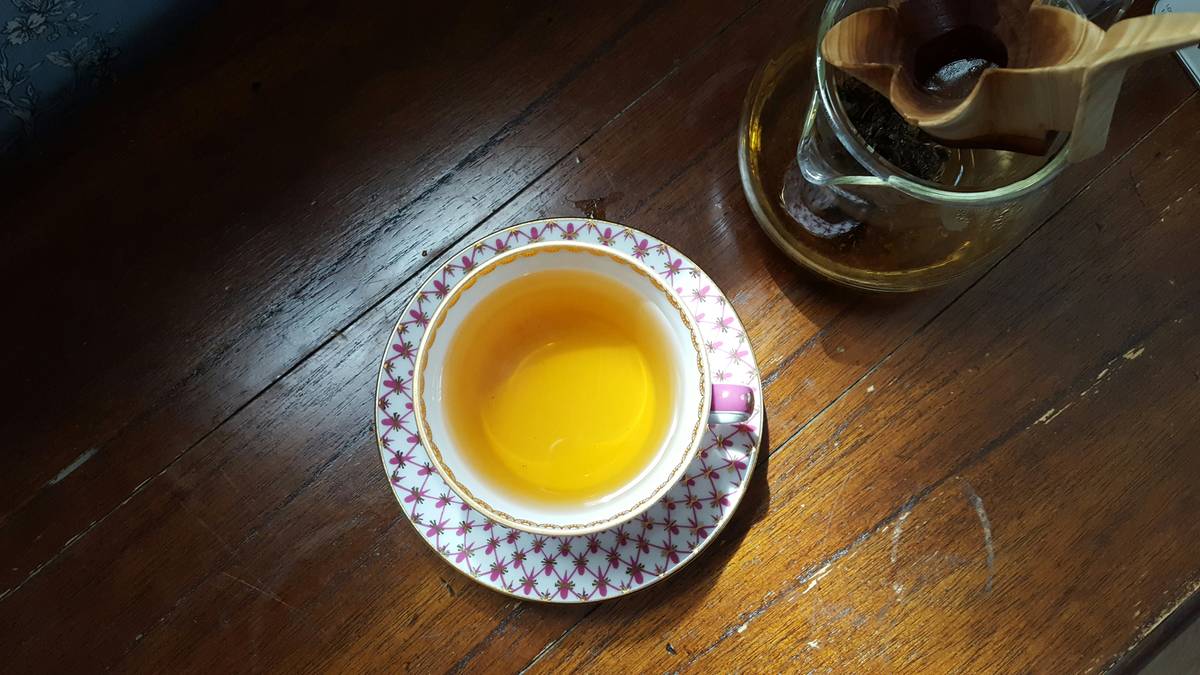 A variety of spices including turmeric and black pepper arranged neatly.